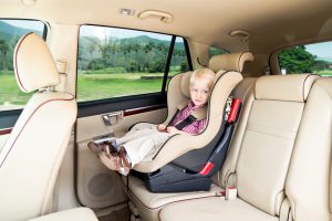 2 1/2 Years Little Boy Sitting in Baby Seat in Vehicle Interior